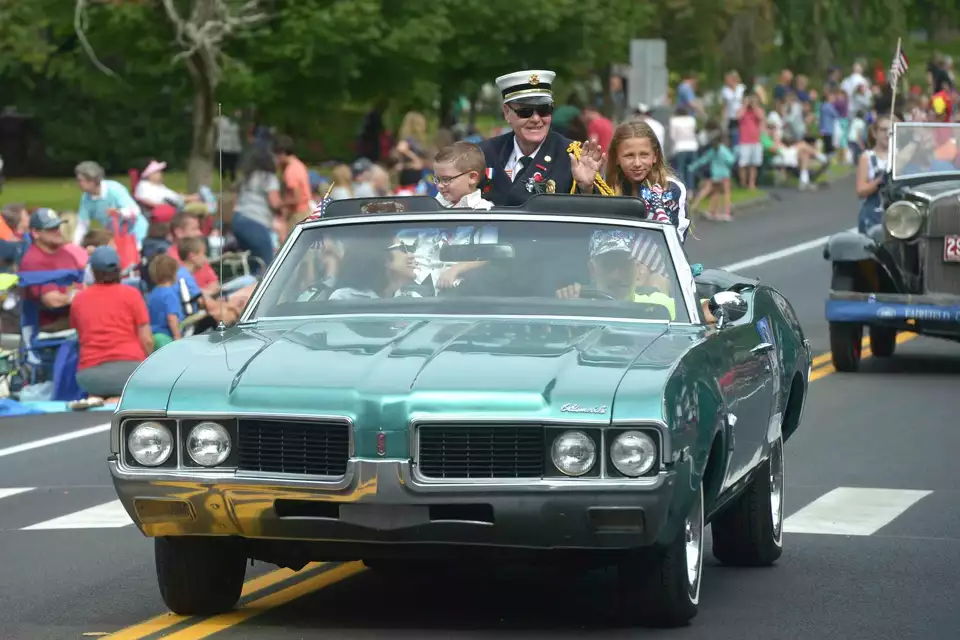 Grand Marshal Bill Halstead rides in the 2019 Newtown Labor Day Parade.